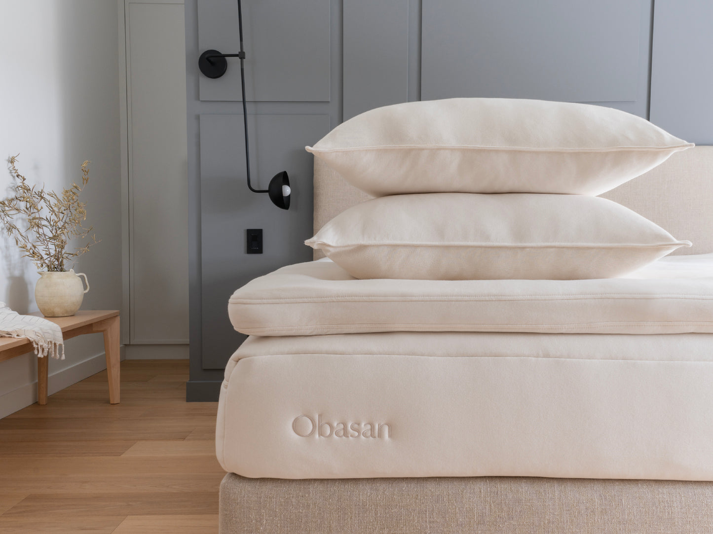 Obasan's bed with a mattress, topper and two pillows