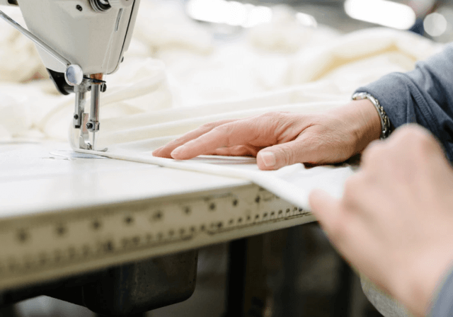 An Obasan worker tailoring our mattresses and bedding products